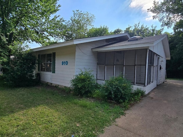 910 S Mills Dr, Euless, TX 76040 - view of side of property featuring a yard and a sunroom