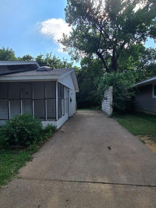 910 S Mills Dr, Euless, TX 76040 - view of side of property featuring a sunroom