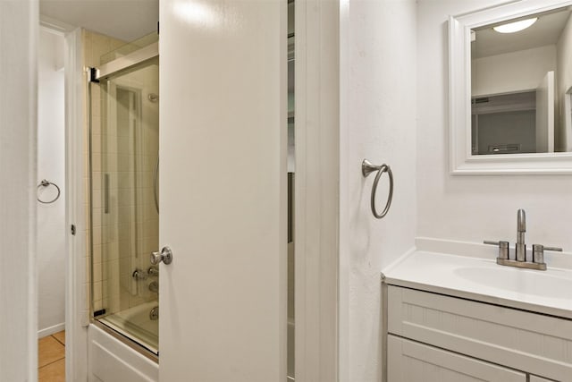 104 Kingsway, Tool, TX 75143 - bathroom featuring vanity, shower / bath combination with glass door, and tile patterned floors