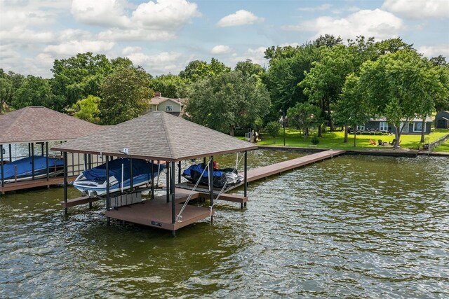 104 Kingsway, Tool, TX 75143 - dock area with boat lift, a water view, and view of scattered trees