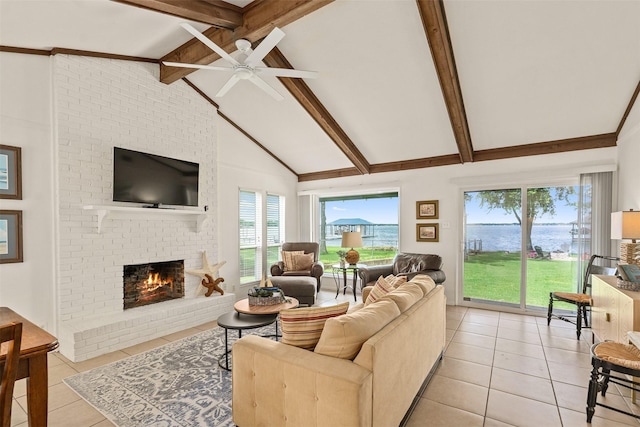 104 Kingsway, Tool, TX 75143 - living room featuring light tile patterned floors, a fireplace, ceiling fan, beam ceiling, and high vaulted ceiling