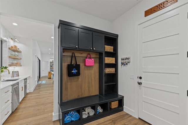 7799 Barber Ranch Rd, Fort Worth, TX 76126 - mudroom with a sink, light wood-style flooring, recessed lighting, and baseboards