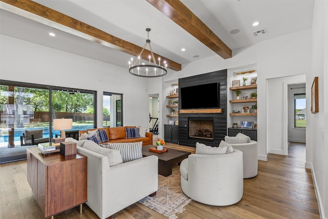 7799 Barber Ranch Rd, Fort Worth, TX 76126 - living room with a fireplace, light wood-style floors, baseboards, a chandelier, and beamed ceiling