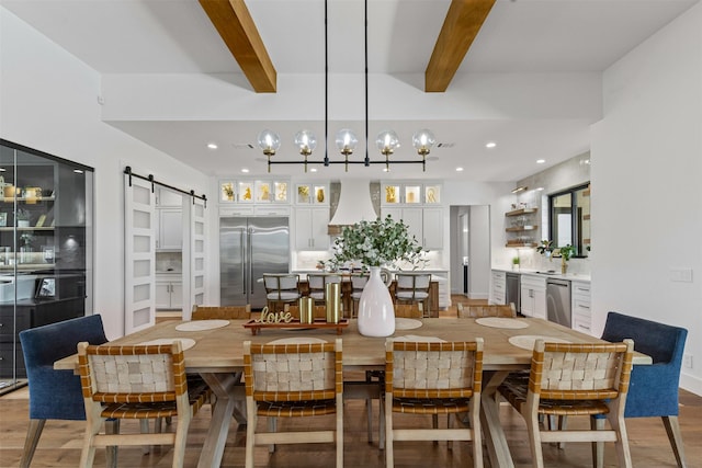 7799 Barber Ranch Rd, Fort Worth, TX 76126 - dining area featuring a barn door, beamed ceiling, light wood-type flooring, and recessed lighting