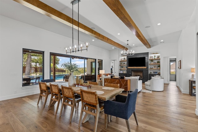 7799 Barber Ranch Rd, Fort Worth, TX 76126 - dining space featuring beamed ceiling, a fireplace, light wood-style flooring, baseboards, and built in features