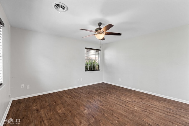 1226 Manor Pl, Shreveport, LA 71118 - unfurnished room with a ceiling fan, dark wood-type flooring, and baseboards