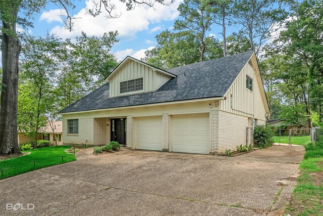 1226 Manor Pl, Shreveport, LA 71118 - view of front facade featuring brick siding, a shingled roof, and driveway