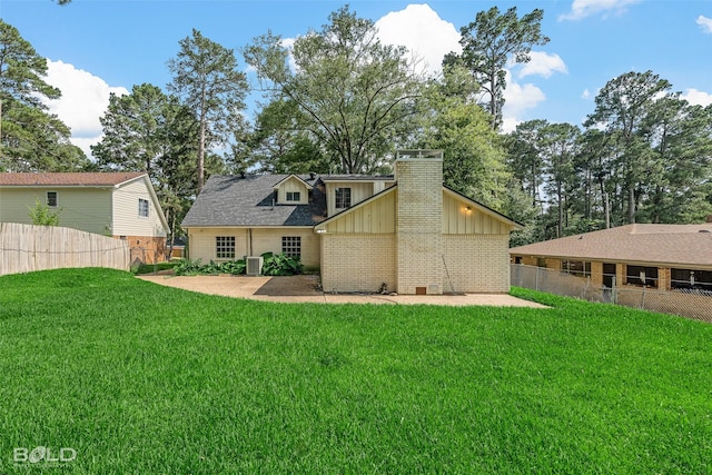 1226 Manor Pl, Shreveport, LA 71118 - rear view of property with brick siding, board and batten siding, a chimney, central AC, and a patio area