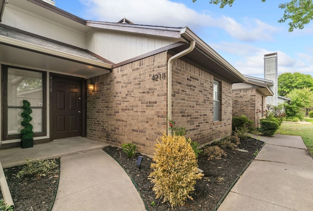 4218 Rollo Ct, Flower Mound, TX 75028 - entrance to property with a chimney and brick siding