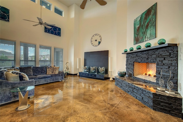18133 Grandview Dr, Forney, TX 75126 - living area with a ceiling fan, a towering ceiling, and a stone fireplace