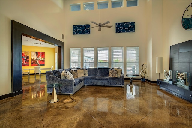 18133 Grandview Dr, Forney, TX 75126 - living room featuring a towering ceiling, ceiling fan, and baseboards