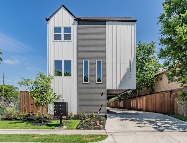 5320 Reiger Ave Unit 101, Dallas, TX 75214 - view of front of house with board and batten siding and concrete driveway