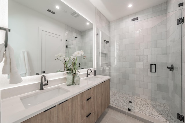 5320 Reiger Ave Unit 101, Dallas, TX 75214 - full bathroom featuring a shower stall, tile patterned floors, recessed lighting, and double vanity