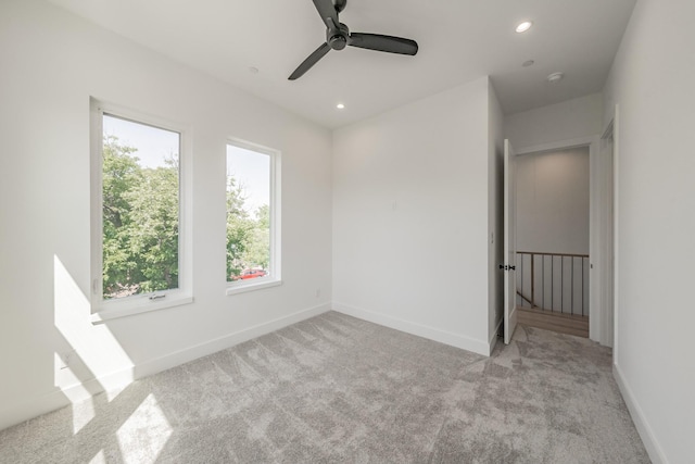 5320 Reiger Ave Unit 101, Dallas, TX 75214 - empty room with healthy amount of natural light, carpet flooring, baseboards, a ceiling fan, and recessed lighting