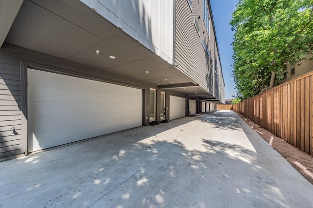5320 Reiger Ave Unit 101, Dallas, TX 75214 - view of side of home featuring concrete driveway