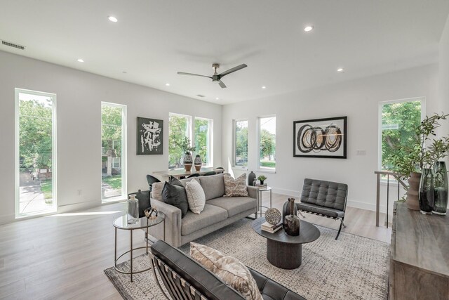 5320 Reiger Ave Unit 101, Dallas, TX 75214 - living area with recessed lighting, plenty of natural light, light wood finished floors, and ceiling fan
