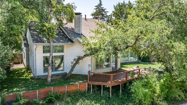 8907 Club Creek Cir, Dallas, TX 75238 - rear view of property featuring a deck, a chimney, brick siding, and a shingled roof
