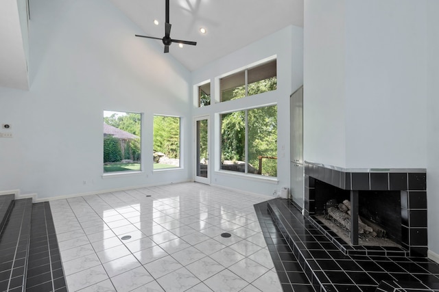 8907 Club Creek Cir, Dallas, TX 75238 - unfurnished living room featuring high vaulted ceiling, ceiling fan, marble finish flooring, recessed lighting, and a fireplace