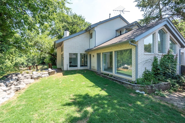 8907 Club Creek Cir, Dallas, TX 75238 - back of property with a chimney, brick siding, and a lawn
