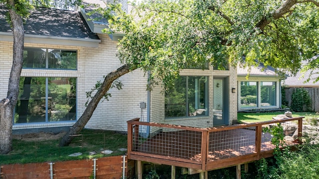 8907 Club Creek Cir, Dallas, TX 75238 - back of house featuring a wooden deck and brick siding