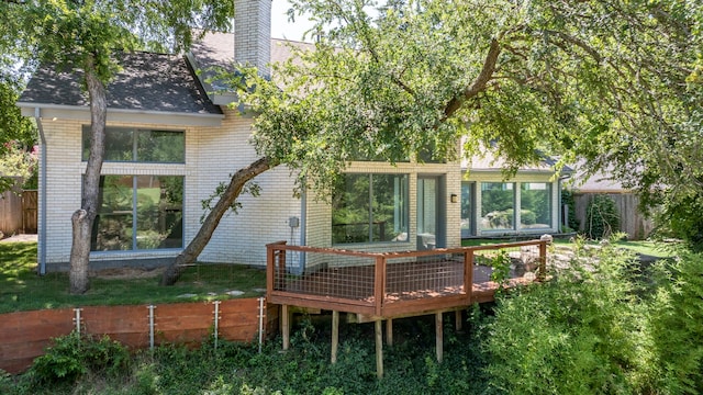 8907 Club Creek Cir, Dallas, TX 75238 - rear view of property featuring a deck, brick siding, a chimney, and a shingled roof
