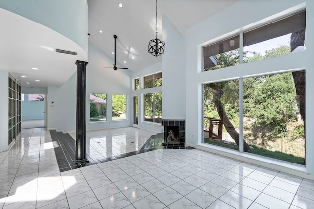 8907 Club Creek Cir, Dallas, TX 75238 - unfurnished living room featuring high vaulted ceiling, marble finish floors, a chandelier, recessed lighting, and a tiled fireplace