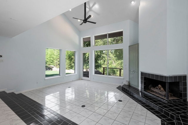 8907 Club Creek Cir, Dallas, TX 75238 - unfurnished living room featuring light marble finish flooring, high vaulted ceiling, ceiling fan, and a tile fireplace