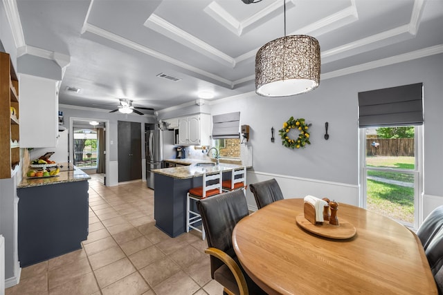 120 Hollie Dr, Red Oak, TX 75154 - dining room with a raised ceiling, ornamental molding, light tile patterned flooring, and ceiling fan