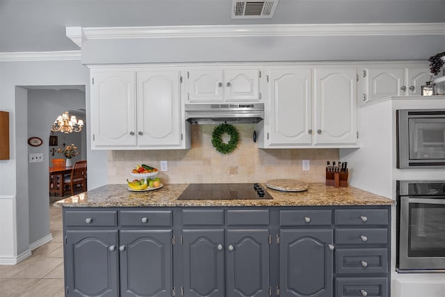 120 Hollie Dr, Red Oak, TX 75154 - kitchen with stainless steel appliances, exhaust hood, gray cabinets, white cabinets, and crown molding