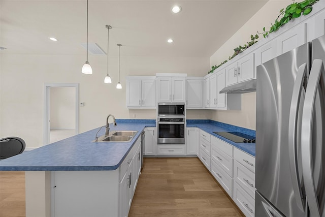 120 Hollie Dr, Red Oak, TX 75154 - kitchen with stainless steel appliances, a sink, dark countertops, white cabinets, and recessed lighting