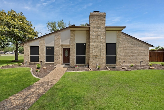 1614 Shadow Moss Way, Carrollton, TX 75007 - view of front of home featuring a chimney and a front lawn