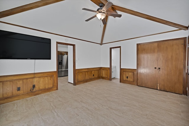 1614 Shadow Moss Way, Carrollton, TX 75007 - unfurnished bedroom featuring stainless steel fridge with ice dispenser, a closet, a wainscoted wall, beam ceiling, and high vaulted ceiling