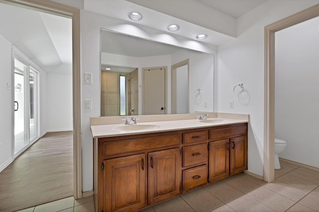 1614 Shadow Moss Way, Carrollton, TX 75007 - full bathroom with double vanity, recessed lighting, tile patterned floors, and a shower