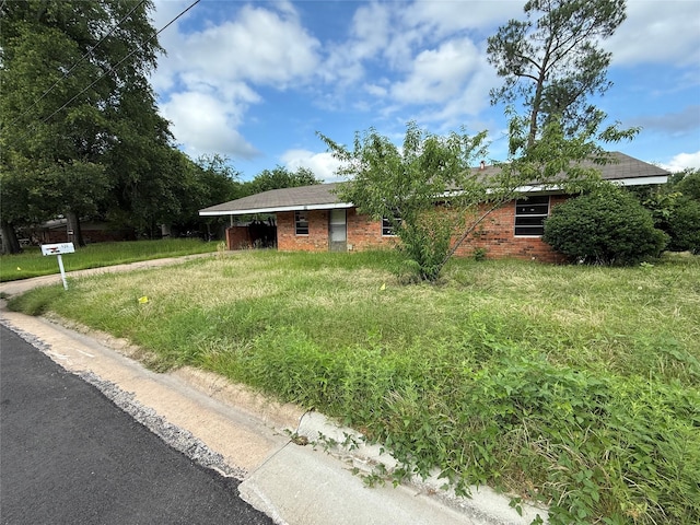 430 Cranford St, Sulphur Springs, TX 75482 - view of front of property with brick siding and a front lawn