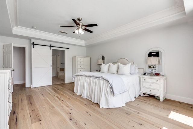 3916 Boulton Ct, Plano, TX 75025 - bedroom with a raised ceiling, crown molding, a barn door, light wood-style floors, and baseboards