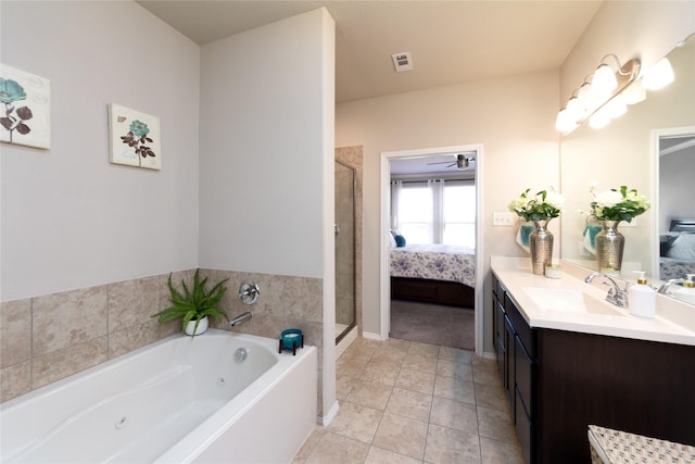 2400 Prairie Trail Ave, Aubrey, TX 76227 - ensuite bathroom with vanity, a jetted tub, a stall shower, a ceiling fan, and tile patterned floors