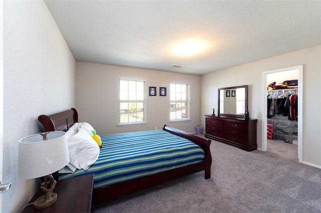 2400 Prairie Trail Ave, Aubrey, TX 76227 - bedroom with carpet floors, a walk in closet, and a closet