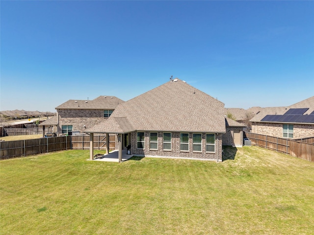 2400 Prairie Trail Ave, Aubrey, TX 76227 - back of house featuring brick siding, a patio, and a shingled roof