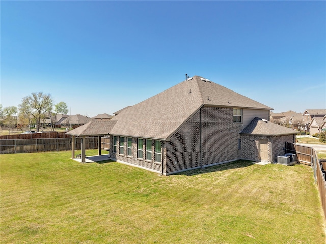 2400 Prairie Trail Ave, Aubrey, TX 76227 - back of house featuring central air condition unit, a shingled roof, and brick siding