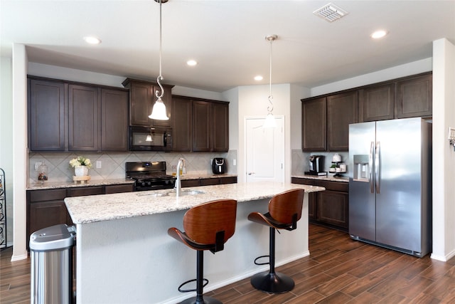 2400 Prairie Trail Ave, Aubrey, TX 76227 - kitchen with black appliances, dark brown cabinets, a sink, dark wood-style flooring, and recessed lighting