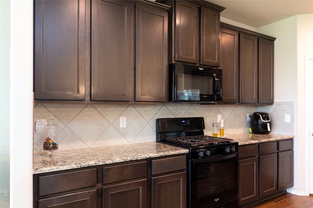 2400 Prairie Trail Ave, Aubrey, TX 76227 - kitchen featuring black appliances, dark brown cabinets, light stone countertops, and decorative backsplash