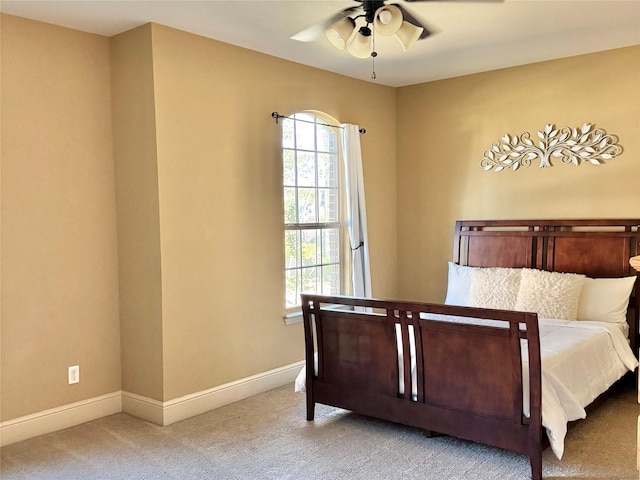 1801 Monaco Dr, Corinth, TX 76210 - carpeted bedroom with multiple windows, baseboards, and a ceiling fan