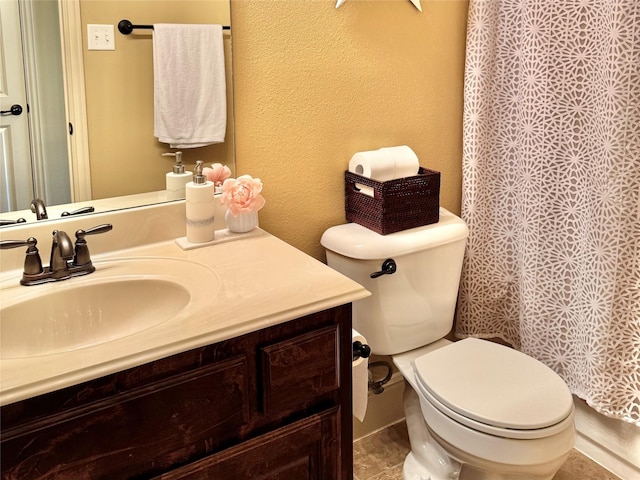 1801 Monaco Dr, Corinth, TX 76210 - bathroom with vanity, toilet, a textured wall, and curtained shower