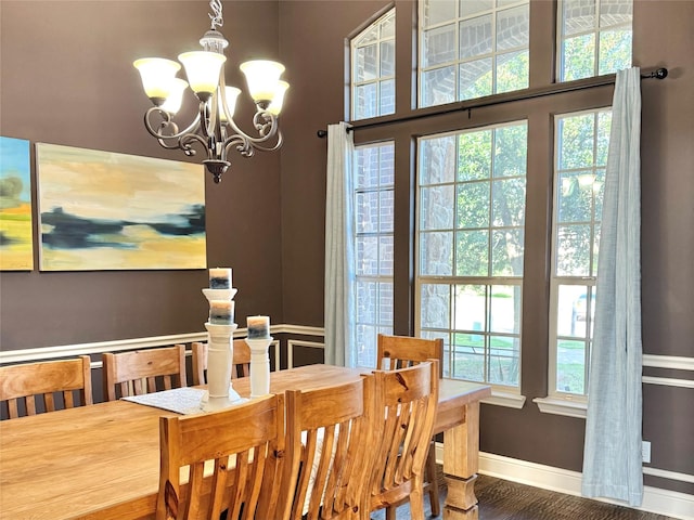 1801 Monaco Dr, Corinth, TX 76210 - dining area with a chandelier, plenty of natural light, baseboards, and wood finished floors