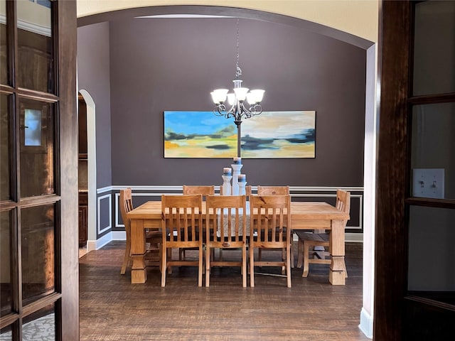 1801 Monaco Dr, Corinth, TX 76210 - dining area with arched walkways, a chandelier, and wood finished floors