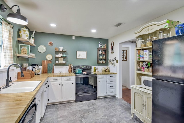 366 W Blackjack St, Dublin, TX 76446 - kitchen featuring open shelves, black appliances, a sink, wooden counters, and recessed lighting