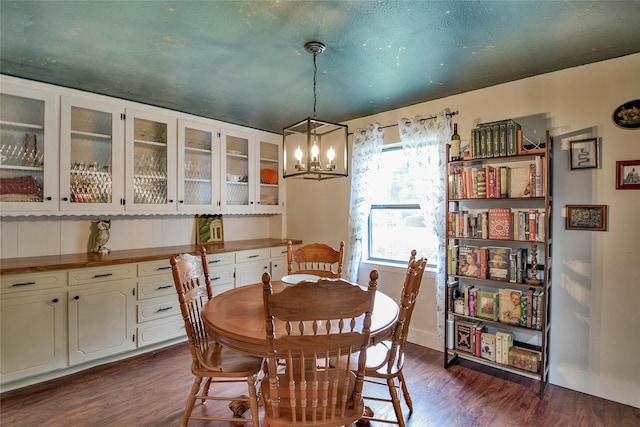 366 W Blackjack St, Dublin, TX 76446 - dining area featuring dark wood-style flooring, a chandelier, and baseboards