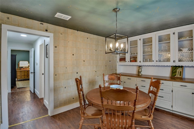 366 W Blackjack St, Dublin, TX 76446 - dining space featuring dark wood-style floors, baseboards, and a chandelier