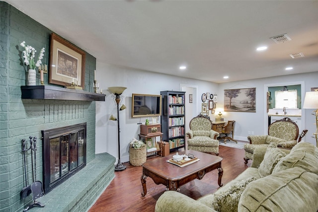 366 W Blackjack St, Dublin, TX 76446 - living area with a brick fireplace, wood finished floors, baseboards, and recessed lighting