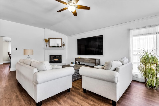 432 Maplegrove Rd, Cedar Hill, TX 75104 - living room featuring vaulted ceiling, a ceiling fan, a glass covered fireplace, dark wood-style floors, and baseboards